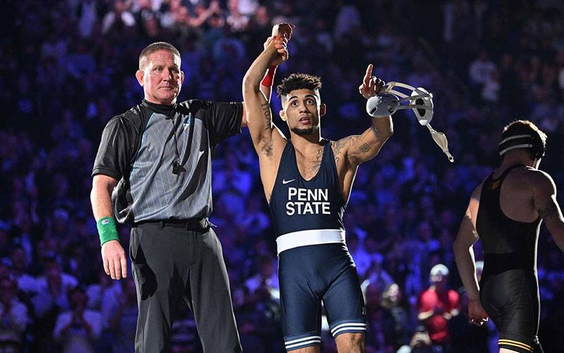 Roman Bravo-Young (Penn State) with arm raised after win against Iowa.