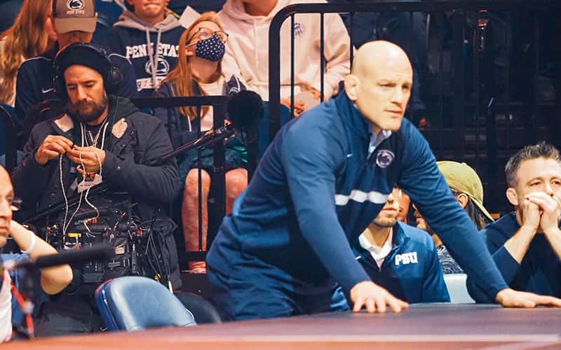 Penn State coach Cael Sanderson matside during Iowa dual meet.