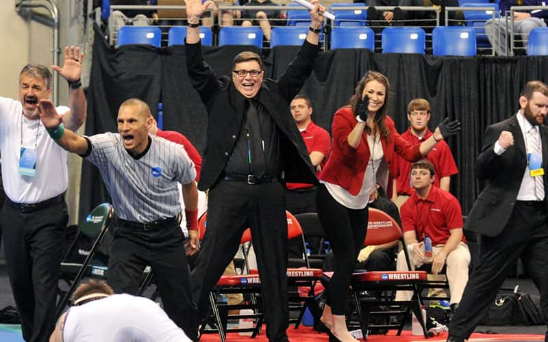 Maryville head wrestling coach Mike Denney celebrates while coaching