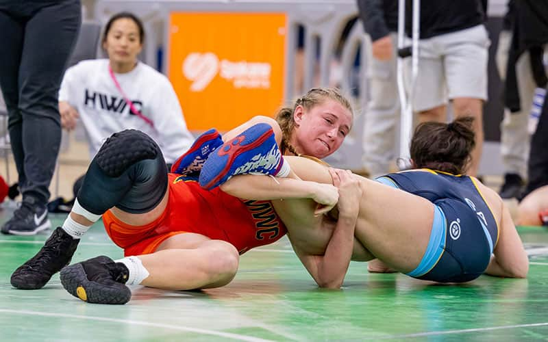 Kylie Welker of Wisconsin, a University of Iowa wrestler, works an ankle lace in the U20 National finals.