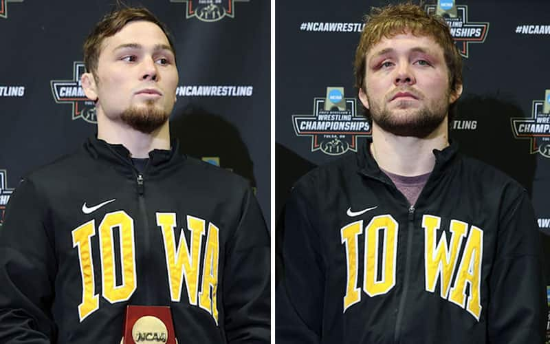 Spencer Lee and Jacob Warner wearing their Iowa warmups