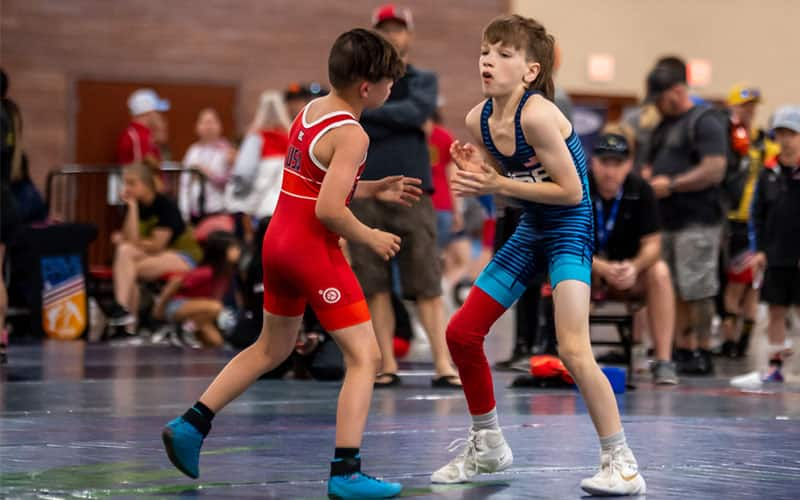 Carmine Crisman and Grayson Goodwin square off at 28 kg at the UWW Futures in Greco-Roman.