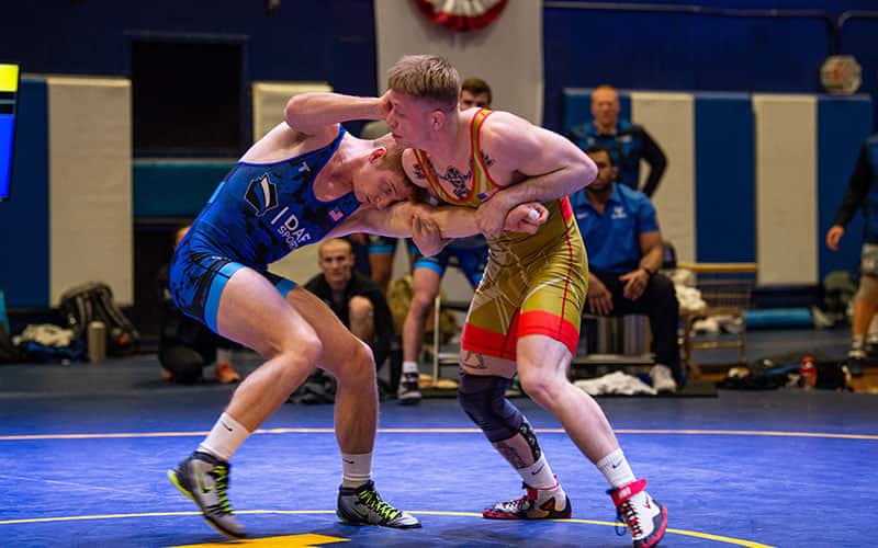 SPC Britton Holmes (U.S. Army) controls the tie against Timothy Worthen (U.S. Navy team/USCG) in 74 kg freestyle match at the 2023 Armed Forces Championships.