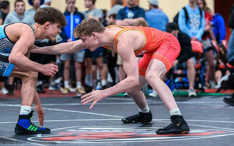 Cooper Hilton of Tennessee, competing at the 2023 U17 Nationals in Las Vegas, reaches for a tie-up position.