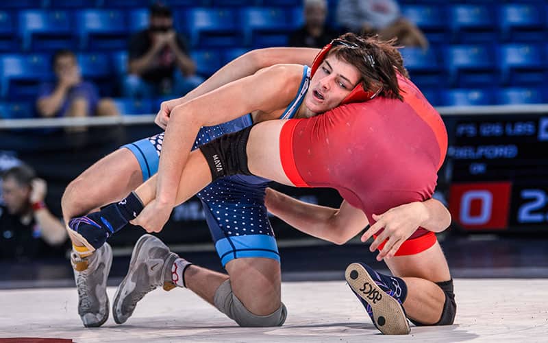 Pennsylvania’s Jax Forrest (blue) picked up a 10-0 technical fall victory at 126 pounds in his opening round match against Oklahoma’s Christian Belford.