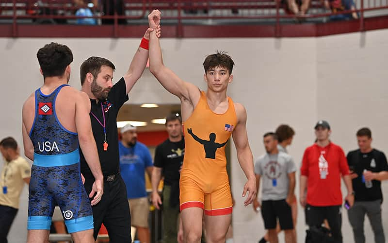 Joel Adams hand raise at U20 WTT. Photo by Sam Janicki.