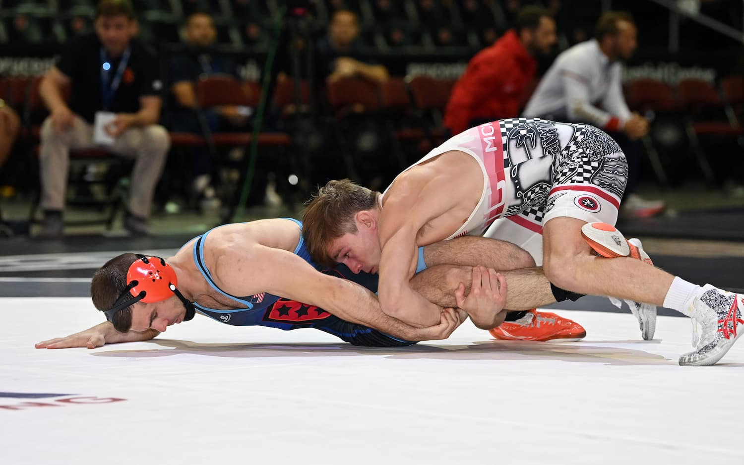 Joseph McKenna scores on Matthew Kolodzik in a men's freestyle true thirds matchup at 65 kg.