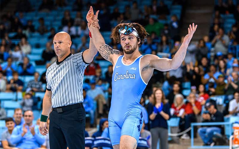 Austin O'Connor (North Carolina) arm raised in victory