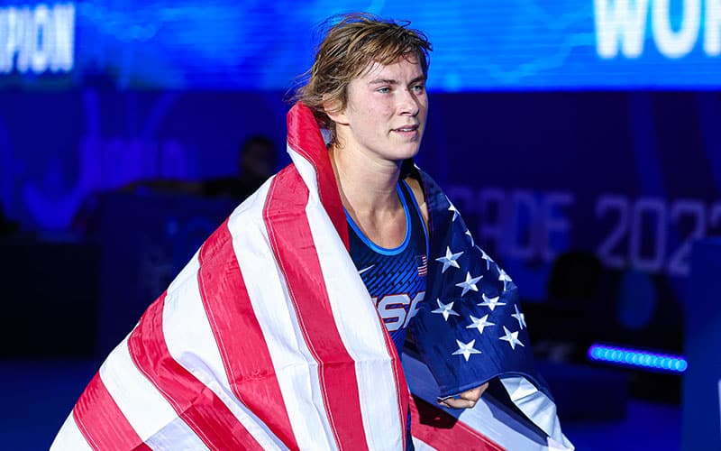 Dom Parrish (USA) with American flag after winning 2022 World gold medal.