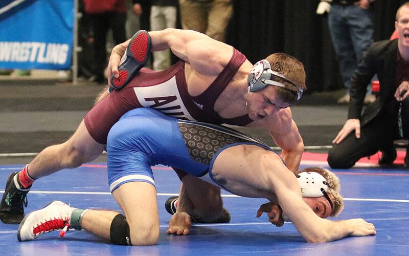 Tyler Shilson (Augsburg) controls an opponent from the top position.