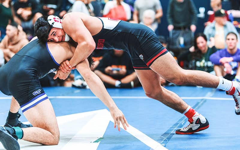 Hunter Garvin of Stanford works a front headlock in competition.