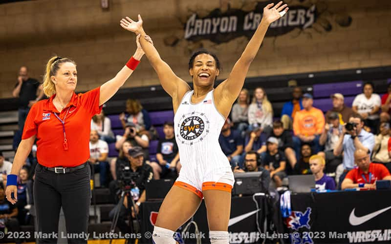 Jacarra Winchester celebrates when having her hand raised in victory at the World Team Trials Challenge Tournament.