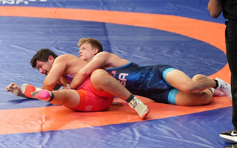 Aiden Cooley (USA) turns Stevan Kojic (Serbia) in their 92 kg match at the 2023 U17 World Championships.