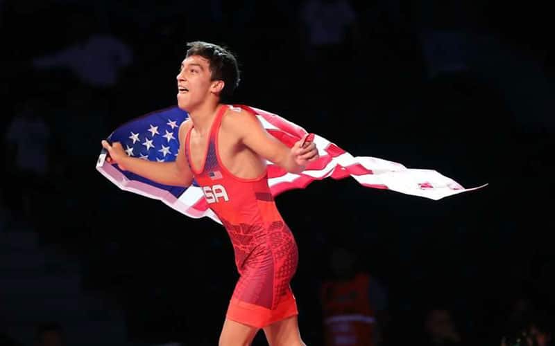 Jordyn Raney (United States) runs with the U.S. flag after winning the U17 Greco-Roman gold medal at 55 kg.