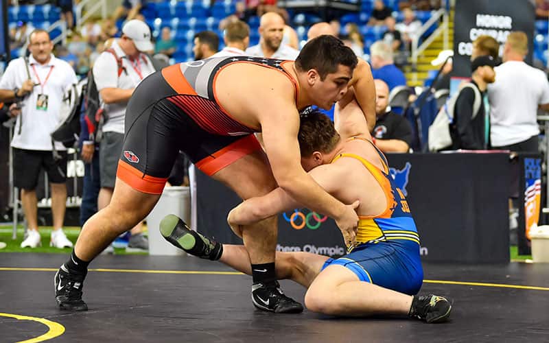 Idaho’s Aden Attao (red) attacks New Jersey’s Rocco Dellagatta in the semifinals at 285 pounds at the 2023 USMC Junior Men’s Freestyle National Championships in Fargo, North Dakota.