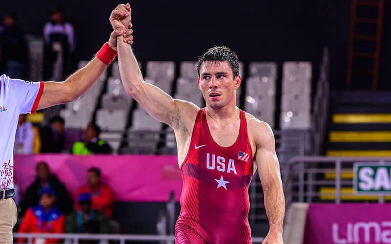 Ildar Hafizov (USA) with arm raised in victory.