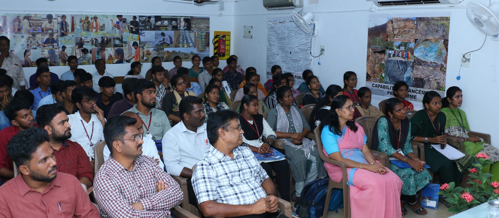 A full seminar room of participants at a capacity-building session