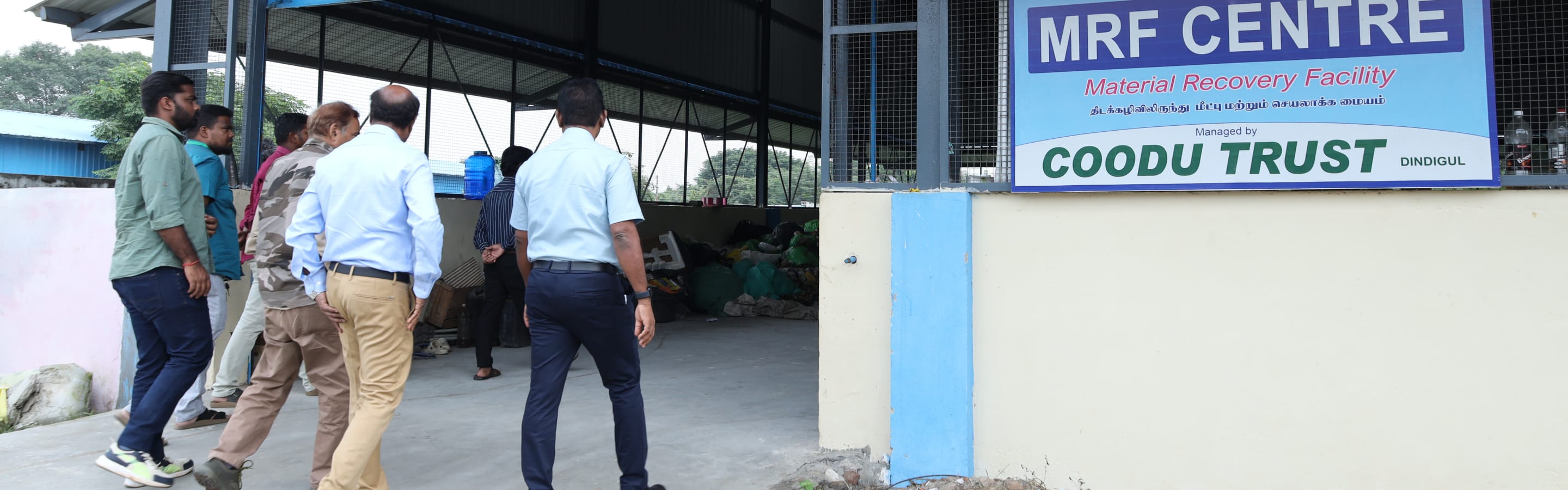 The Material Recovery Facility in Dindigul, its board reading Managed by Coodu Trust