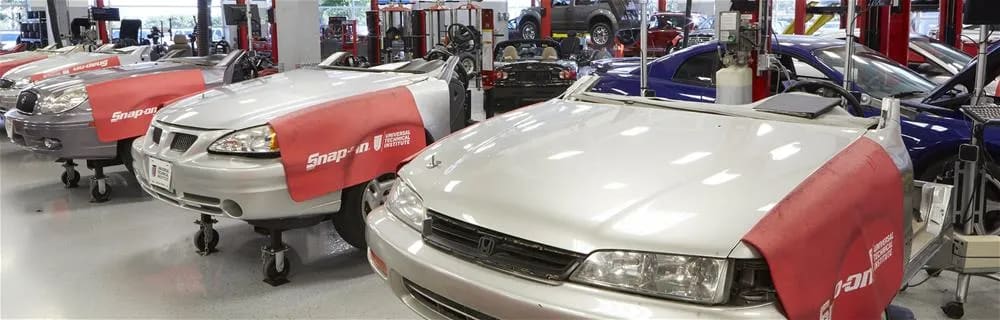 Automobiles being repaired at the UTI labs