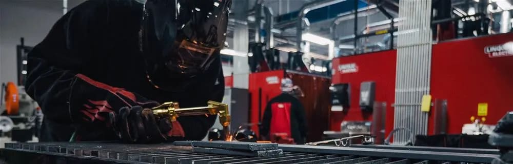 Student using a welder torch