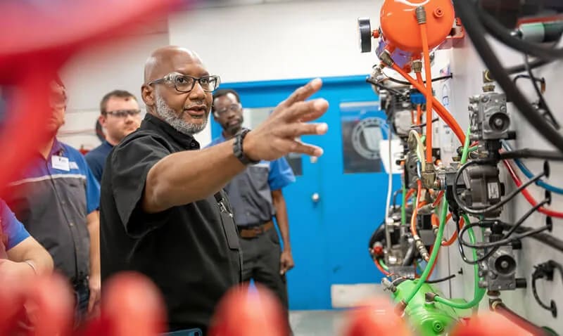 An instructor trains students in the Diesel Technology program at UTI Houston.