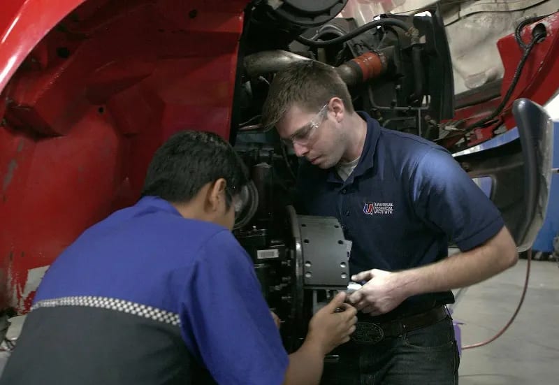 Diesel students work on a set of brakes in a UTI lab.