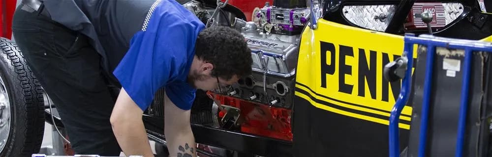 Technician working on an engine block