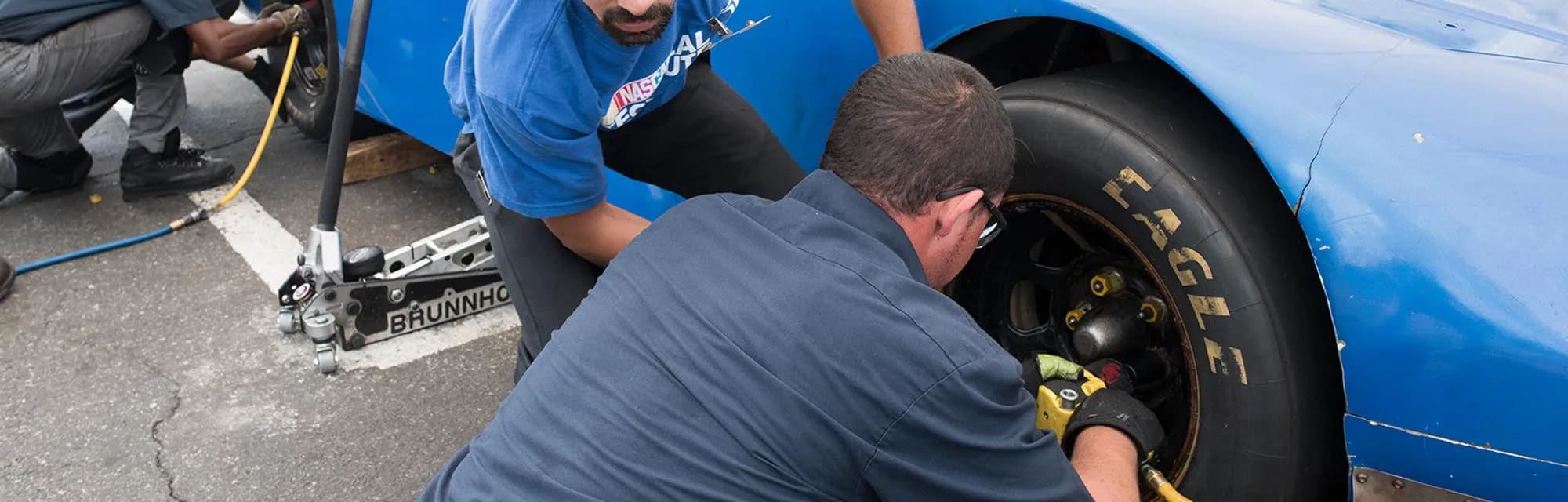 UTI students training to become a pit crew