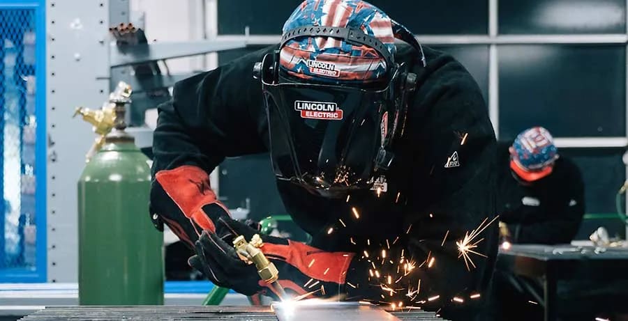 Student works on a weld at a UTI lab.