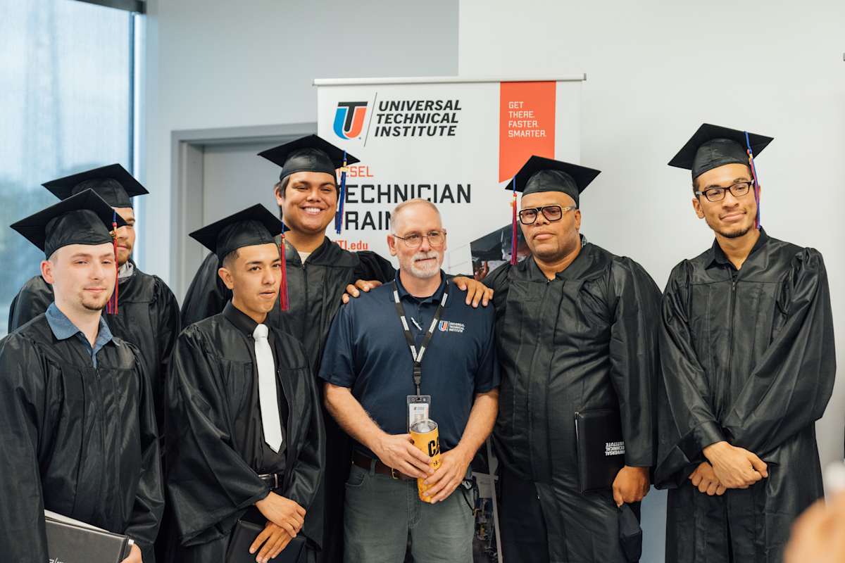 Graduating students with their instructor