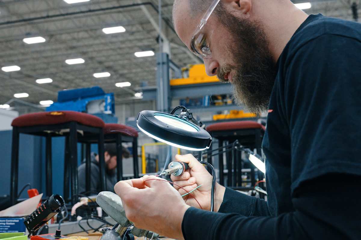 Student learning hands-on, with technology