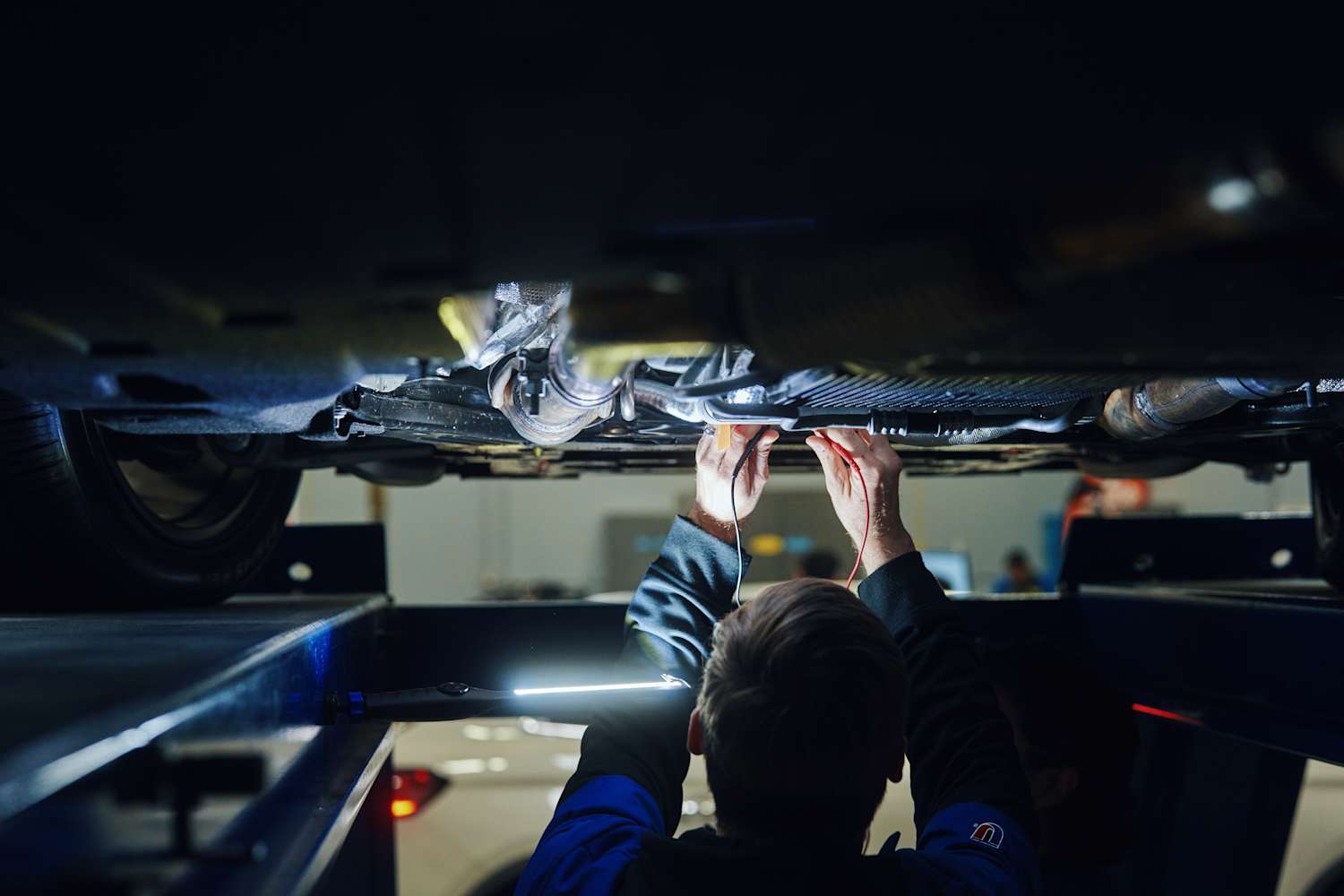 UTI student working on car