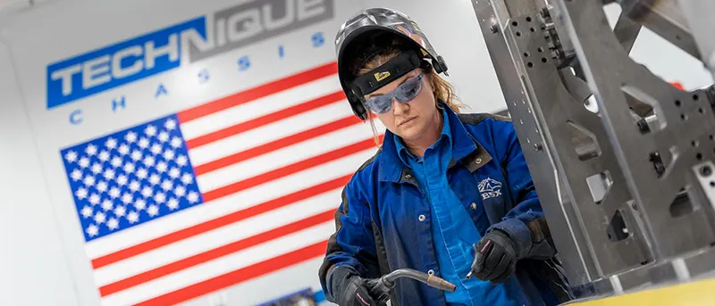 Woman Welding in a Manufacturing Workshop