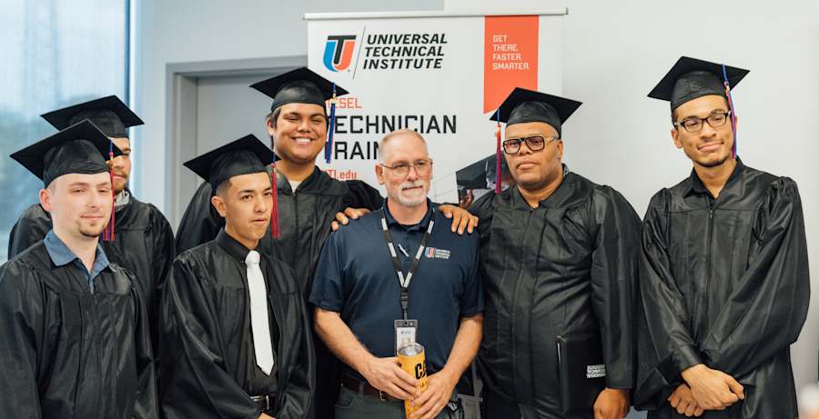Graduating students with their instructor