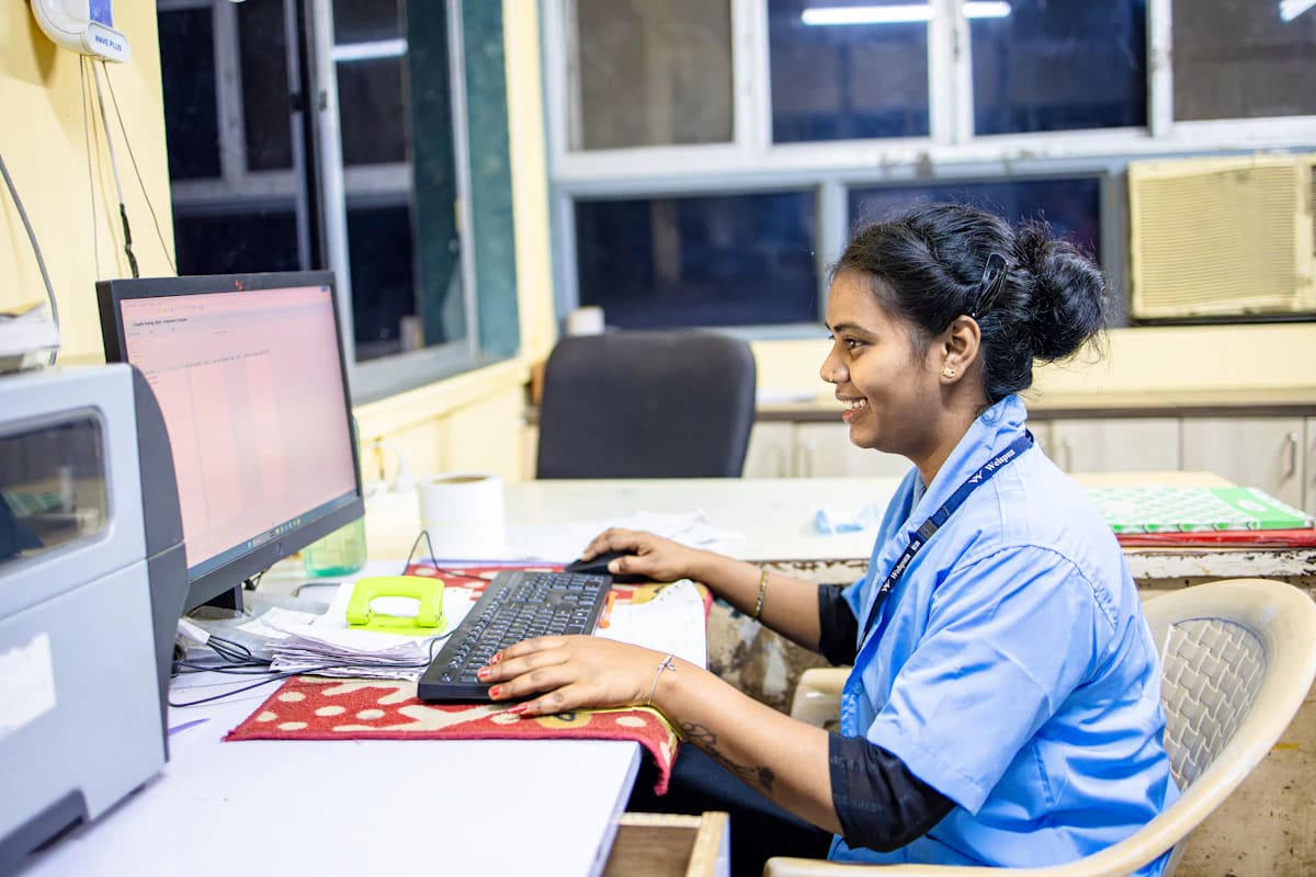 Staff member working on records at a computer