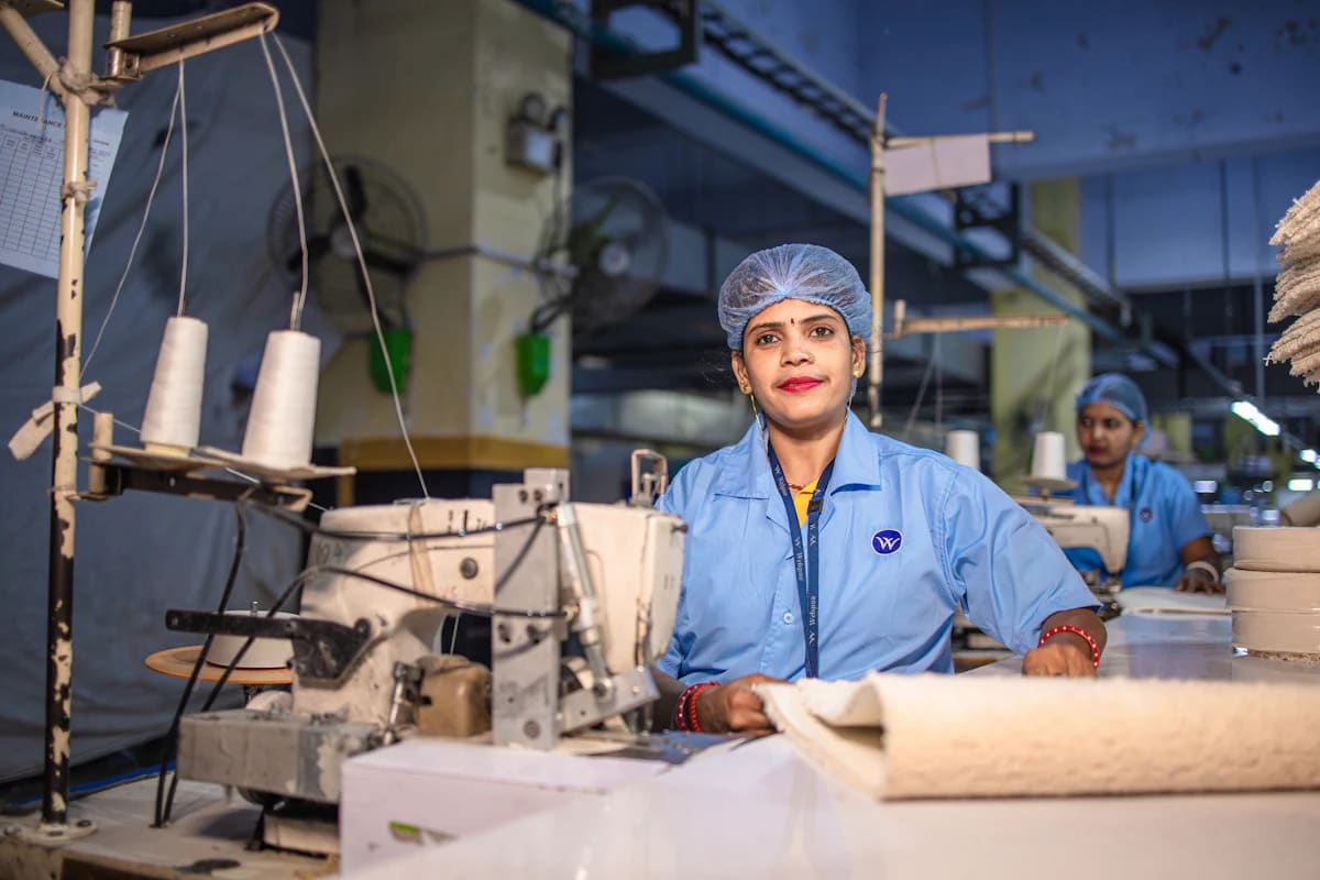 Garment unit worker at a sewing machine