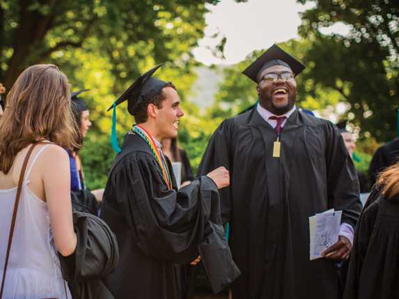 Students laughing at graduation