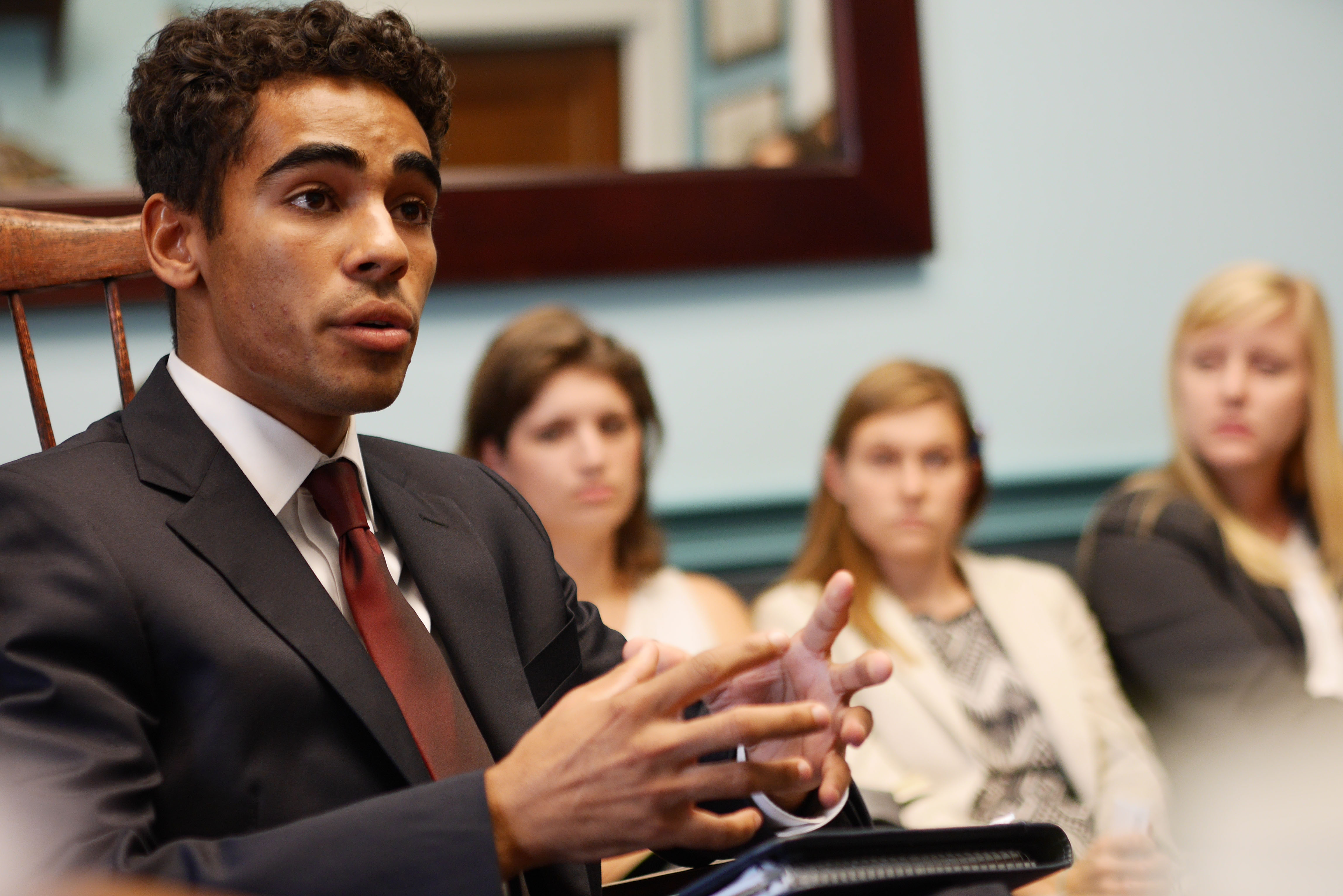 Male student speaking in class