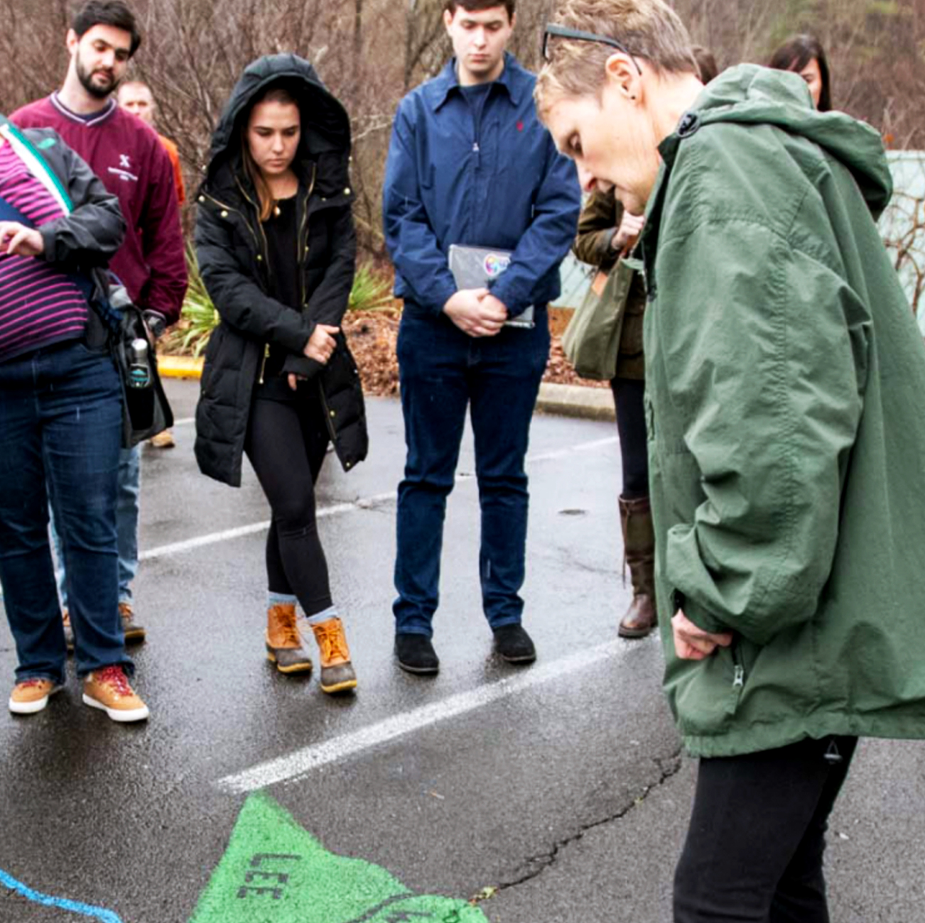 Students standing around looking at a map