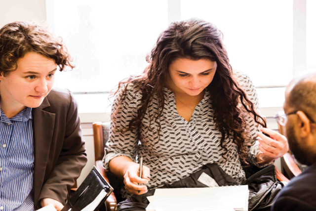 Students looking at some papers