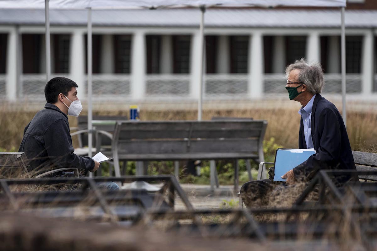 Warburg advises one of his students outside Garrett Hall