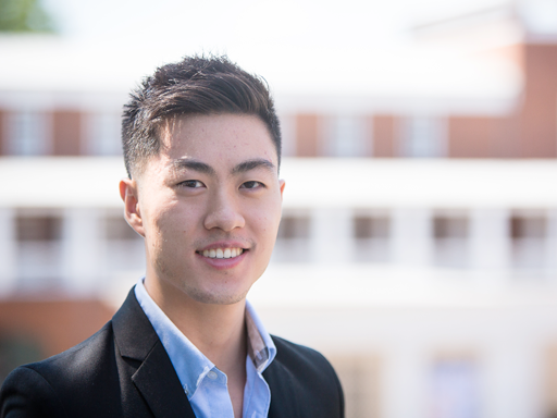 Young man smiling with a suit on