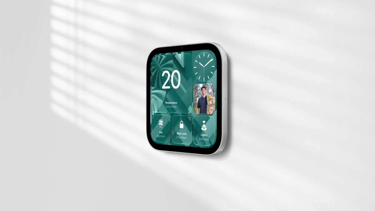 Apple HomeView wall-mounted model showing living room temperature, a front door camera feed and fan, door lock and light controls