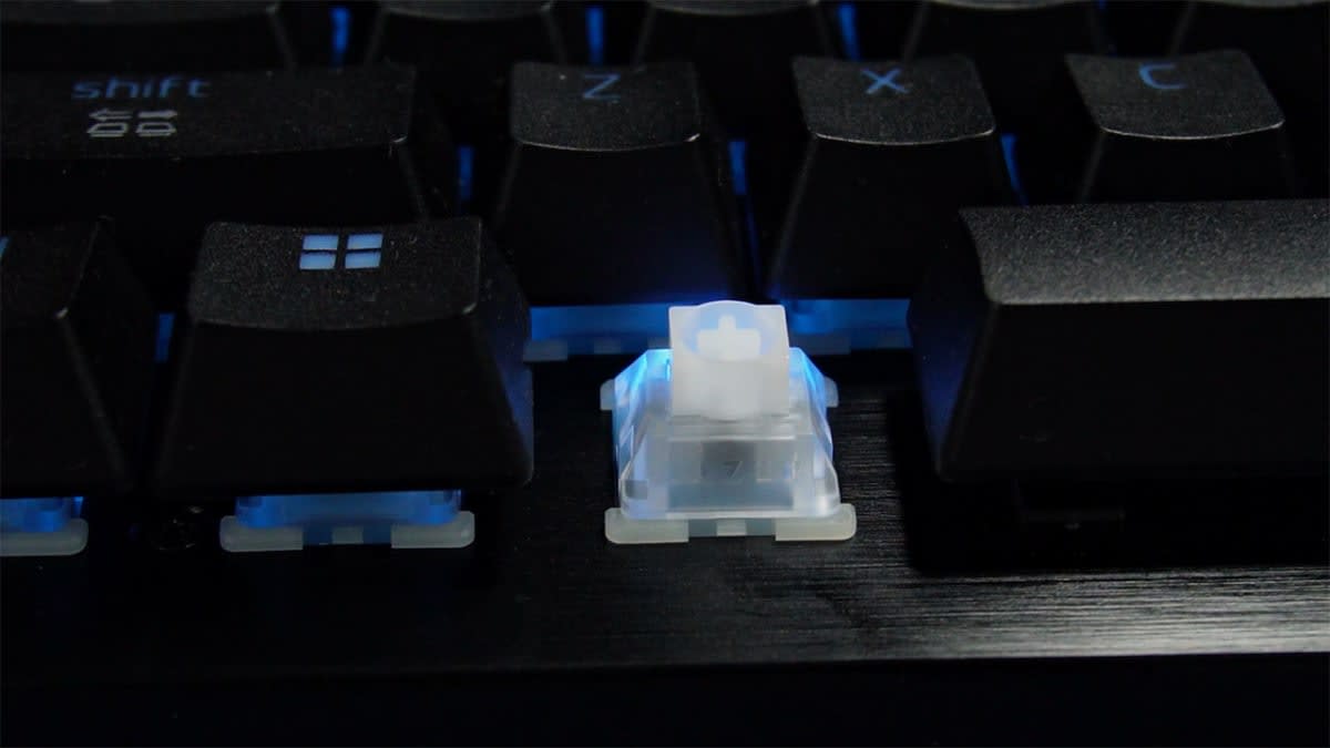A Razer Hall Effect magnetic switch on the Huntsman V3 HE Magnetic TKL with the keycap removed, beside the shift, Z and X keys.