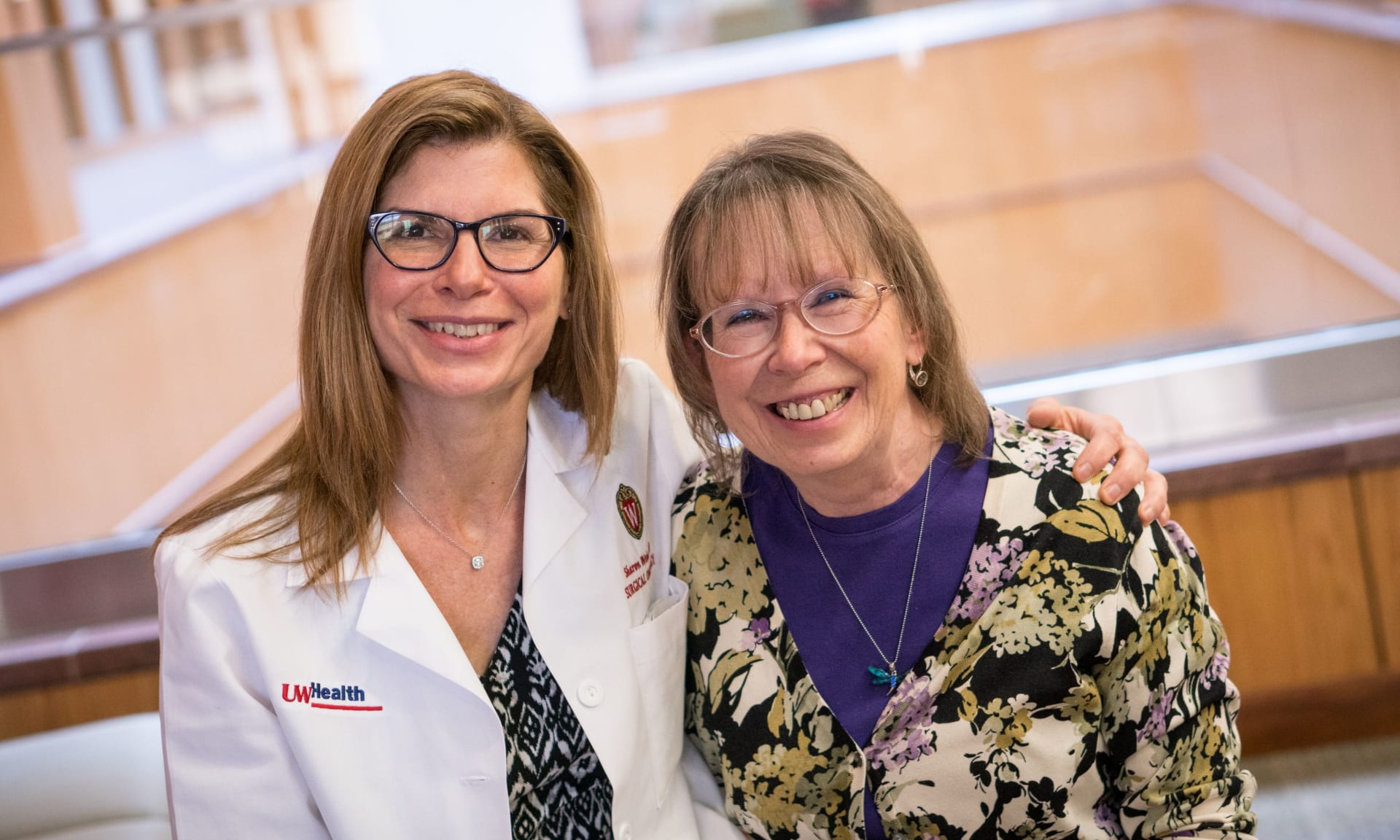 Weber 184426-1839.jpg A female doctor and female patient sit together smiling