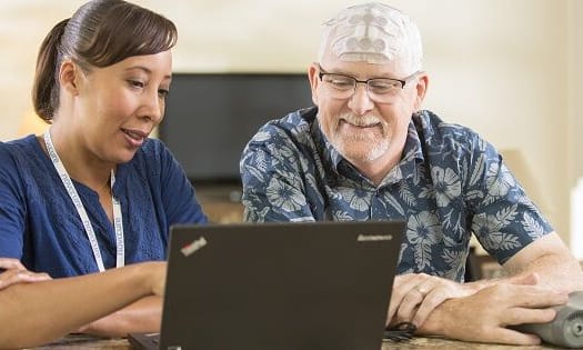 Novacare_Optune_Device_600 Provider showing patient laptop
