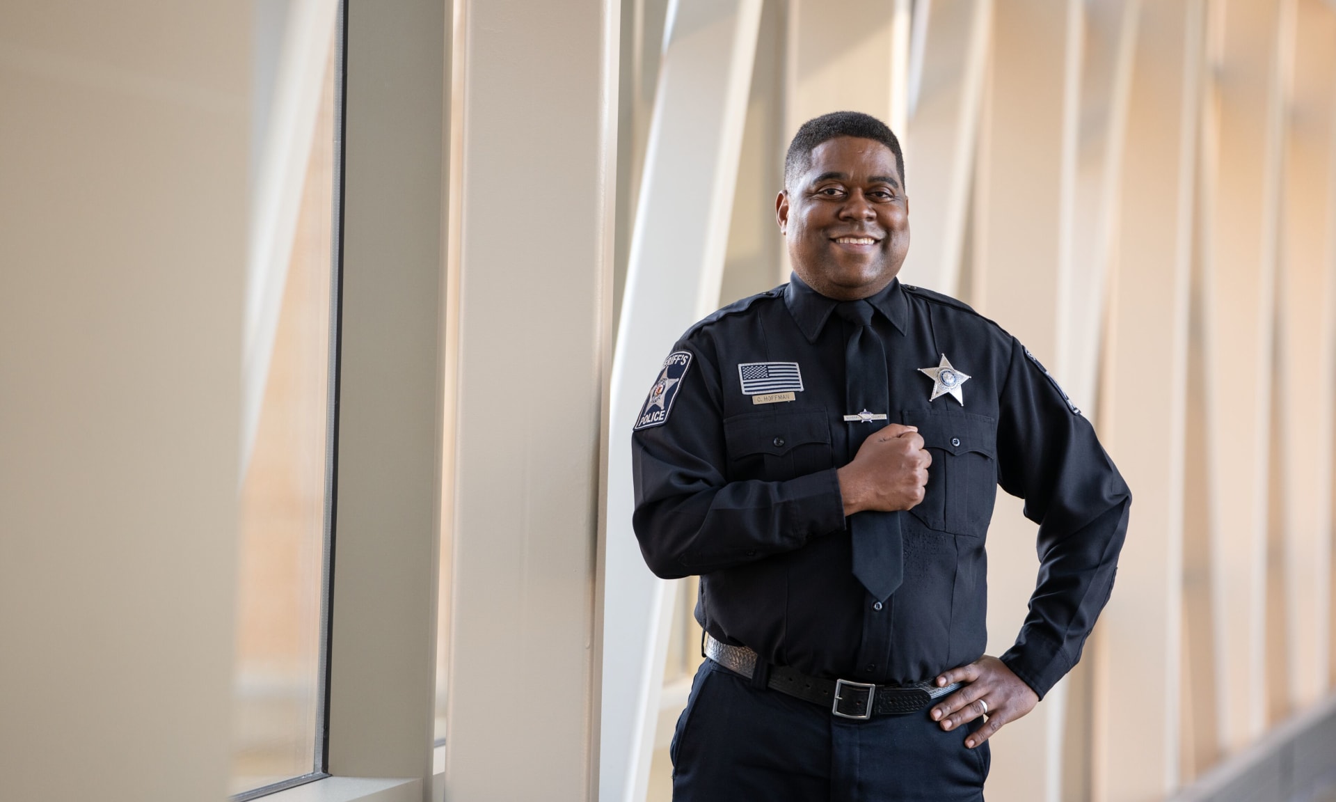 Hoffman 433625-2235.jpg Man in sheriff uniform standing and smiling