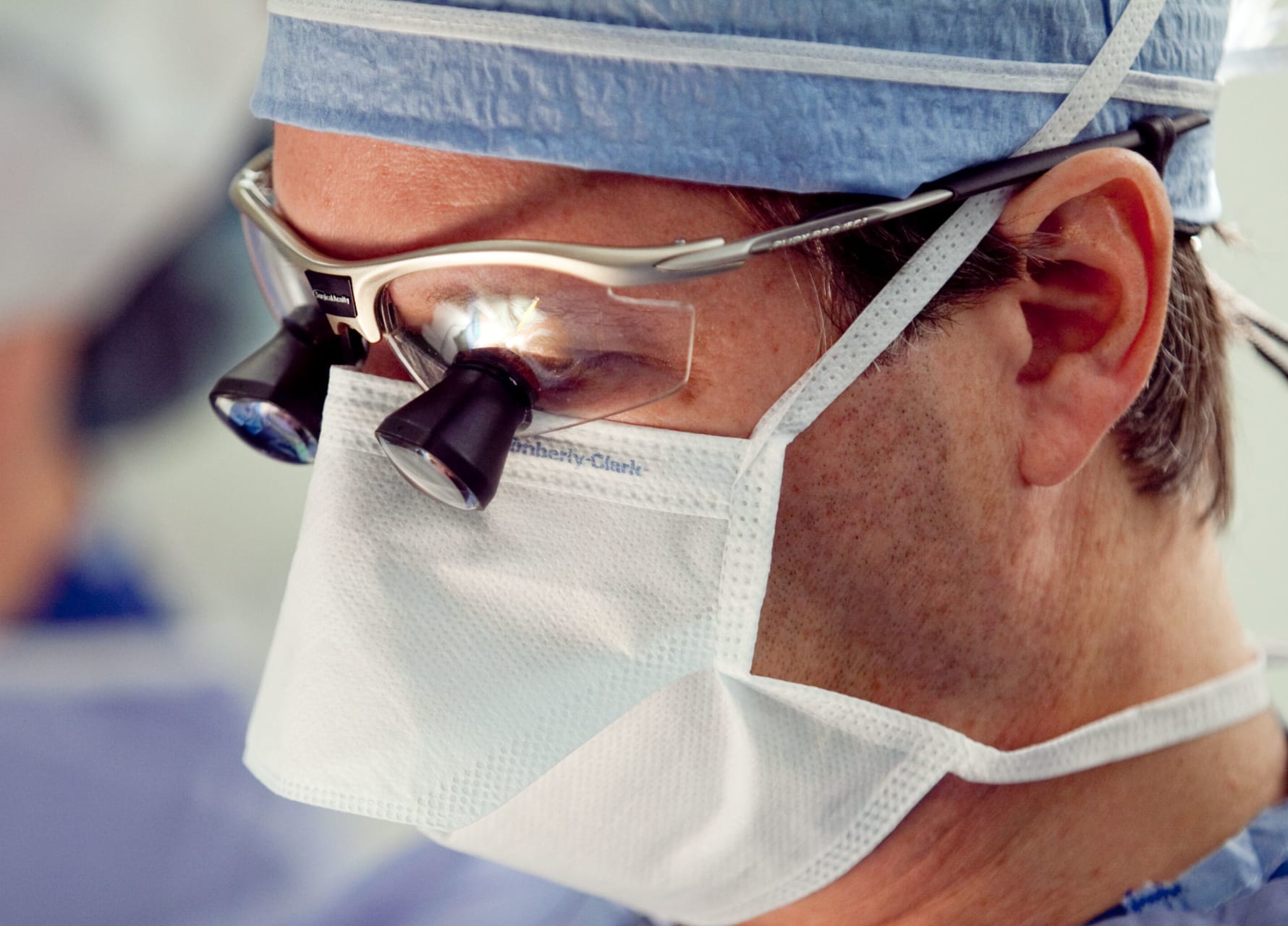 Kaufman-0399 Doctor wearing mask and scrubs in operating room