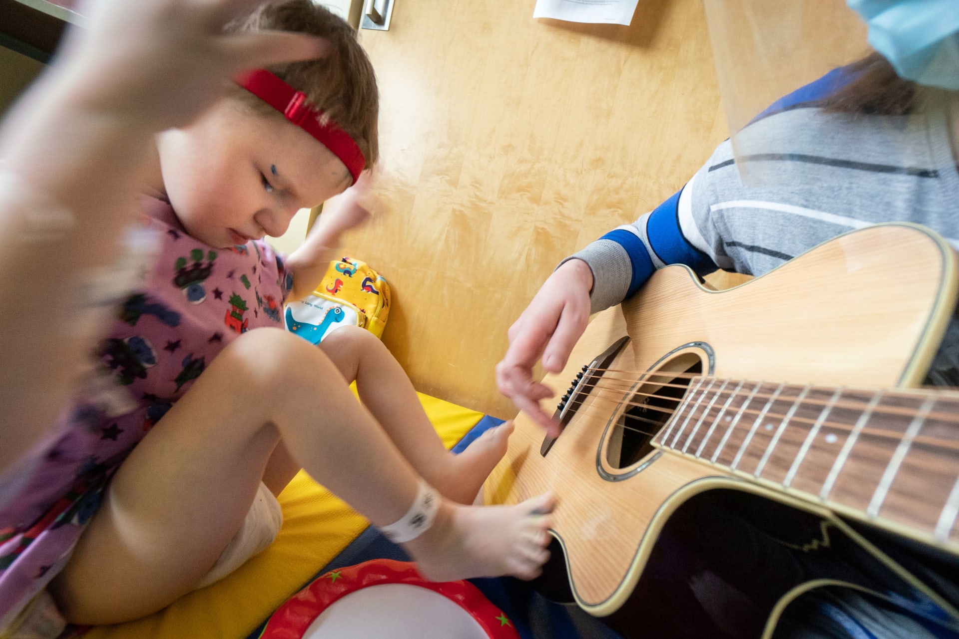 Music Therapy 626990-6573 Music therapist and young patient