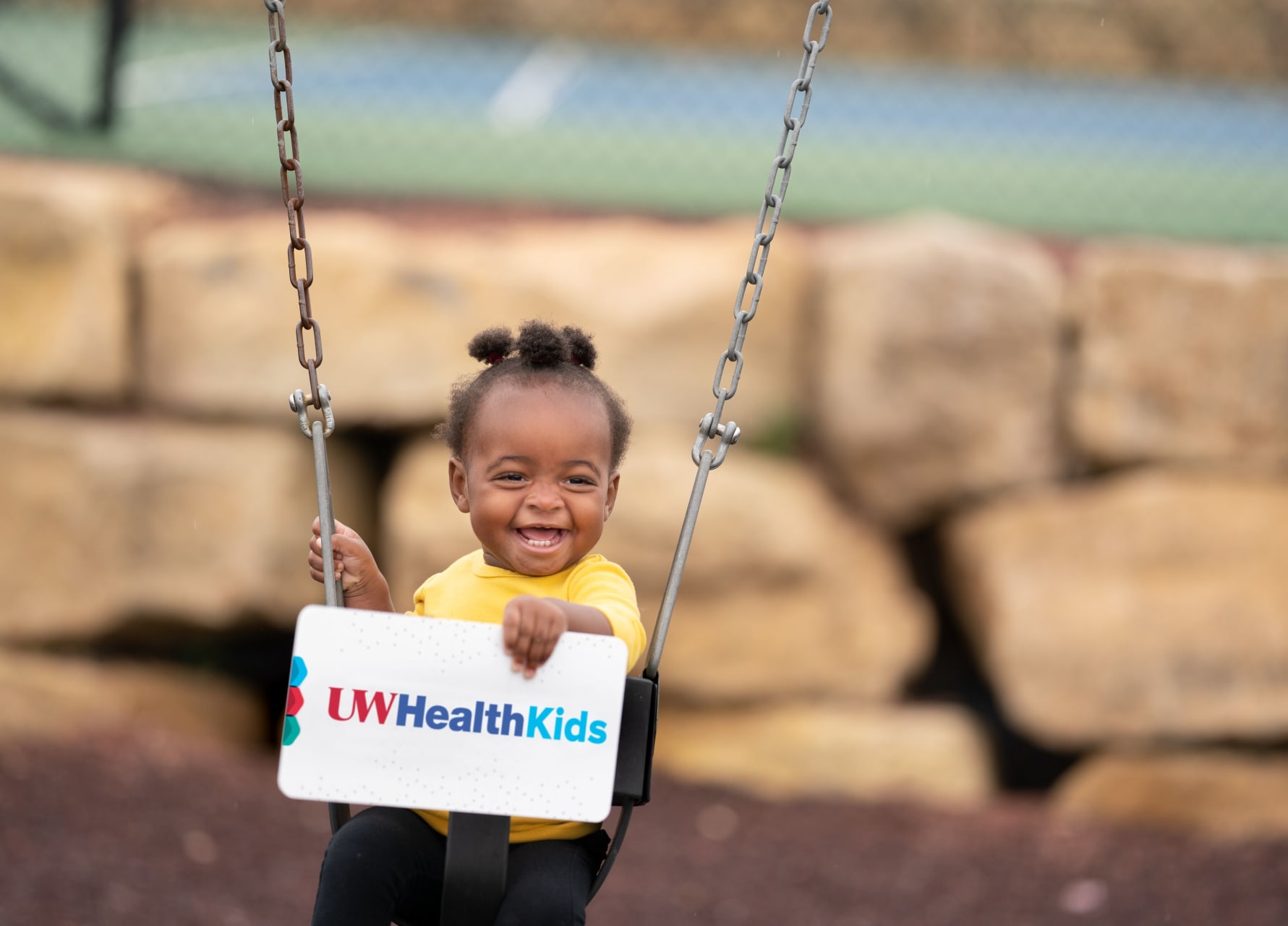 Hayden 805366-1907 Smiling child with signing UW Health Kids